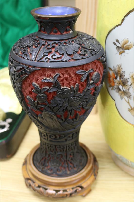 A pair of Chinese two colour carved lacquer vases and a Chinese yellow ground vase tallest 46cm